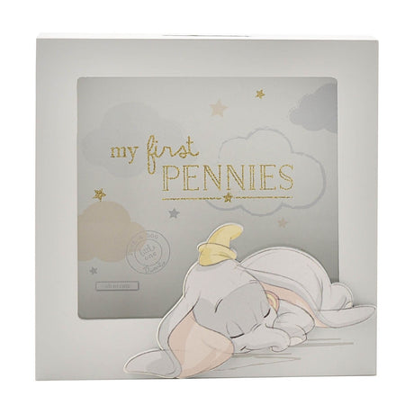 Square grey wooden money box with window showing "my first PENNIES" in gold on a cloud and star backdrop, with a sleeping Dumbo cut-out along the base.