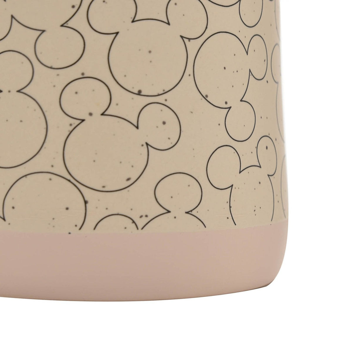 Close-up of the Mickey Mouse Outline Ceramic Planter in beige, showing overlapping black-outline Mickey heads on a speckled surface with a blush-pink base.