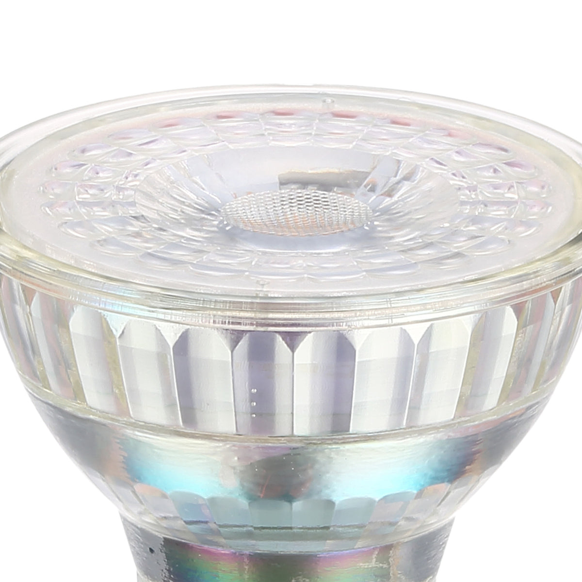 Close-up of a dimmable GU10 LED bulb with faceted clear glass reflector and patterned front lens around a central optic, shown on a plain white background.