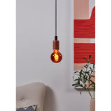 Dimmable LED G80 globe bulb with copper-tinted glass and visible spiral filament, E27 fitting, shown lit on a pendant cord in a living room setting.
