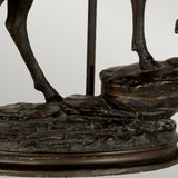 This is a close-up of the Angus-2 Table Lamp's base, showcasing detailed, textured steps with two hooves elegantly poised on top. The lamp features a dark bronze patina, enhancing its realistic contours and detailed design akin to an intricate stag statuette.