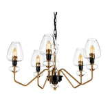 The Armand 5 Light Chandelier - Aged Brass Plated & Charcoal Black Paint boasts a contemporary design with a frame finished in aged brass and charcoal black. It includes five clear glass shades, each enveloping a candle-shaped bulb, and hangs elegantly from a black chain, enhancing the sophistication of any room.