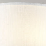 Close-up of the Cooper Medium Curved Wall Light in polished chrome emitting soft, warm light—a perfect fit for contemporary interiors. The smooth surface features vertical lines, adding a subtle pattern. The top edge of the fixture is slightly visible against a neutral background, enhancing modern elegance.
