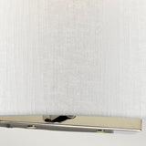 The Cooper Medium Curved Wall Light - Polished Chrome features a close-up view of its white fabric lampshade and polished chrome rectangular base with a visible switch, set against a plain background. Ideal for contemporary interiors, it seamlessly combines elegance with functionality.