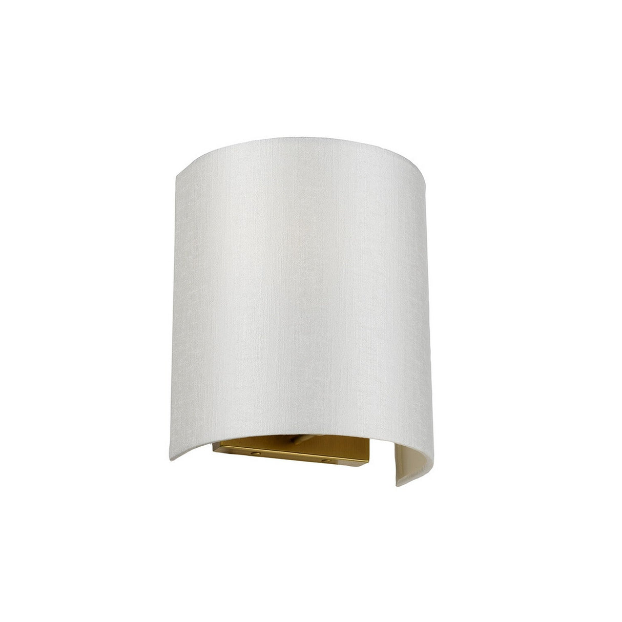 The Cooper Small Curved Wall Light in aged brass features a contemporary design with a curved, cylindrical white fabric shade that provides ideal ambient lighting. This fixture is open at both the top and bottom, with the interior emitting a gentle golden glow.