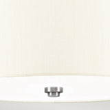 A close-up of the Fletcher 14" Flush - Polished Chrome With Ivory Shade reveals its cream-colored fabric lampshade paired with a polished chrome ceiling fixture at the center bottom. The combination of textured fabric and smooth metal provides a striking contrast, enhancing its modern lighting aesthetic against a light and neutral backdrop.