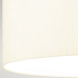 Close-up of an ivory textured lampshade from the Fletcher 18" Flush in a polished chrome finish, set in a contemporary interior. The fabric has a smooth appearance with subtle vertical lines, while the bright white interior reflects light. The image focuses on the lower portion of the lampshade against a pale background, complementing the Fletcher Flush Ceiling Fixture.