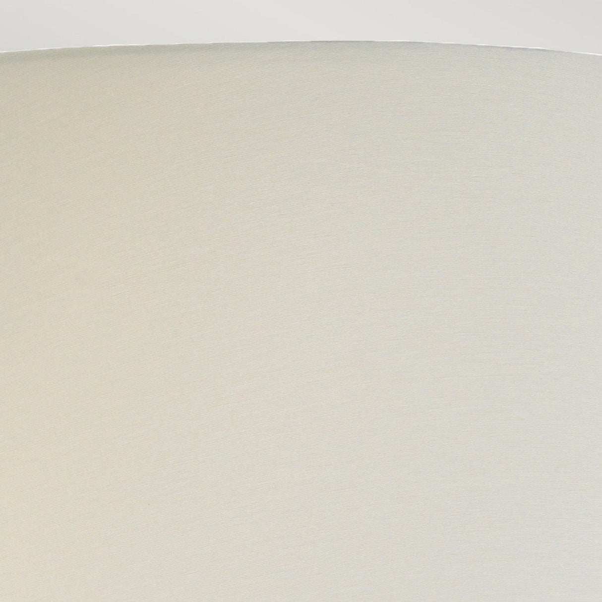 Close-up view of the plain, celadon empire shade from the Harbin Gourd Table Lamp, featuring a smooth texture against a light gray background. The image captures the curved edge and surface, emphasizing its simplicity and elegance.