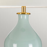 The Harbin Gourd Table Lamp with a Tall Empire Shade in celadon finish features a modern design with a curved base and gold accent at the neck, set against a neutral background.