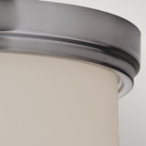 Close-up of the Kincaid 3 Light Flush - Polished Chrome, showcasing its smooth, polished chrome edge and an opal-etched glass diffuser. The image highlights the sleek and modern design of this light against a plain background.