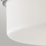 Close-up of a smooth, opal-etched glass lampshade from the Kincaid 3 Light Flush - Polished Chrome against a light gray background. The matte surface complements the polished chrome fixtures, whose top edge is slightly visible, accentuating its rounded shape.