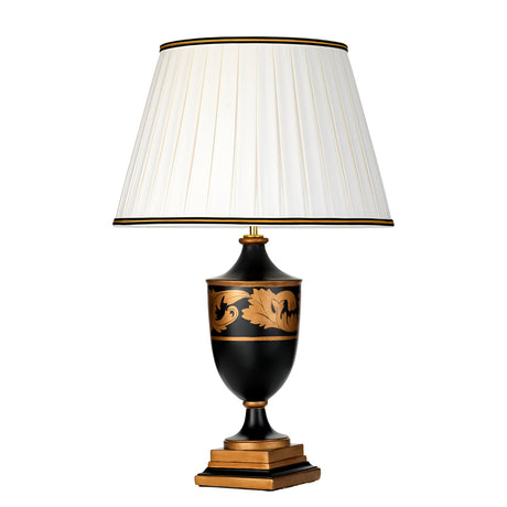 The Narbonne Table Lamp - Black & Gold is a sophisticated lighting fixture showcasing a white pleated lampshade and an ornate base with black and gold leaf patterns atop a square, layered pedestal, embodying classical beauty and timeless elegance.