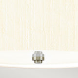 Close-up of a white ceiling showcasing the Pearce 14" Pendant Light with its small, dome-shaped design in polished chrome. The background is adorned with textured beige wallpaper, enhancing the lighting fixture's sleek elegance and modern charm.