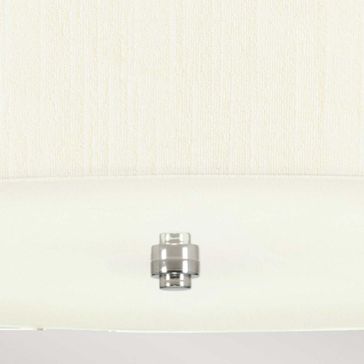 Close-up of a Pearce 22" Pendant Light with a polished chrome finish and an ivory shade against a plain, light-colored wall, ideal for modern interiors.
