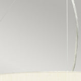 Close-up of the Pearce 26" Pendant Light featuring an ivory fabric-covered shade. Thin wires hold the fixture against a neutral background, enhancing its minimalist aesthetic. The bottom edge of the shade is visible, showcasing a soft, textured appearance with polished chrome accents.