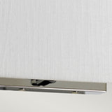 Close-up of the Riley Medium Rectangular Wall Light - Polished Chrome, showcasing its textured white shade and elegant polished chrome base. This modern fixture provides ambient lighting and is partially visible against a light gray background.