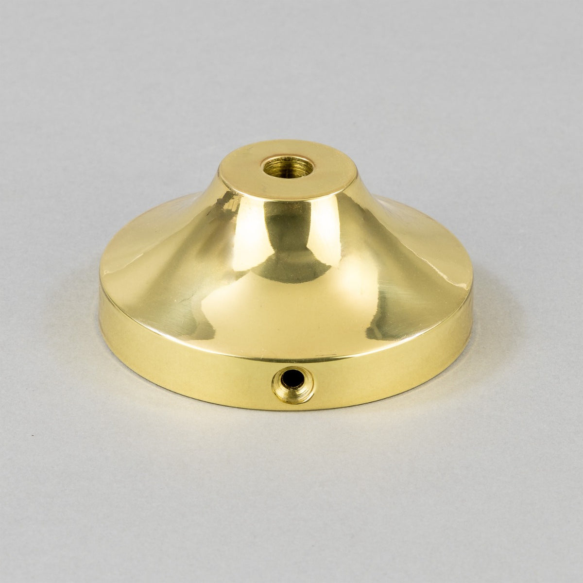 Doon Brass Pendant Light ceiling cap, a wide-brimmed polished brass shade with central E27 lampholder opening and side fixing screw, shown on a plain light grey background.