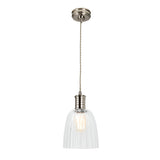 The Douille 1 Light Pendant - Polished Nickel showcases a hanging design with a clear, ribbed glass shade and polished nickel finish metal fittings. It features a vintage-style LED filament bulb that adds charm, all suspended by a twisted cord from a round ceiling mount.