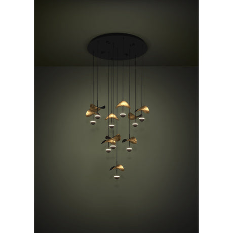 Dracera 10 Light Pendant in black, a cascading ceiling fixture with slim drops holding curved leaf-shaped shades in black and gold above small illuminated domes.