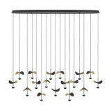 Dracera 17 Light Linear Pendant Light in black steel, with an oval canopy, long black cords, and curved leaf-shaped shades in black and gold over small LED domes, on a white background.