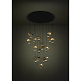 Dracera 17 Light Pendant in black, a round ceiling canopy with cascading cords holding curved leaf-like shades in gold and black over small warm-white LED domes, staggered at varying heights.