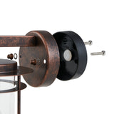 Exploded view of the Drimena outdoor wall light's antique copper wall plate and black mounting backplate with motion sensor, screws, and square arm, shown on a white background.