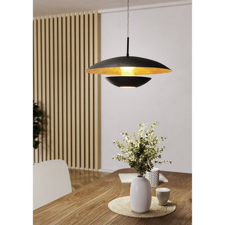 Dronvelle Pendant Light in brown and gold, a two-tier steel dish shade with crinkled gold interior, shown over a dining table in a modern room.