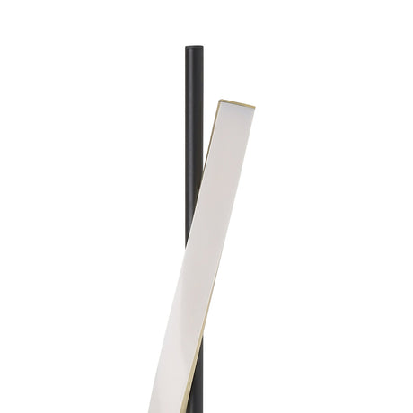 Close-up of the Drosmine LED floor lamp showing the slim black pole with a twisting white diffuser ribbon edged in brushed brass, on a plain white background.