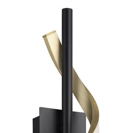 Close-up of Drosmine LED wall light with a slim matt black rod and a brushed brass ribbon spiralling around it, set against a plain white background.