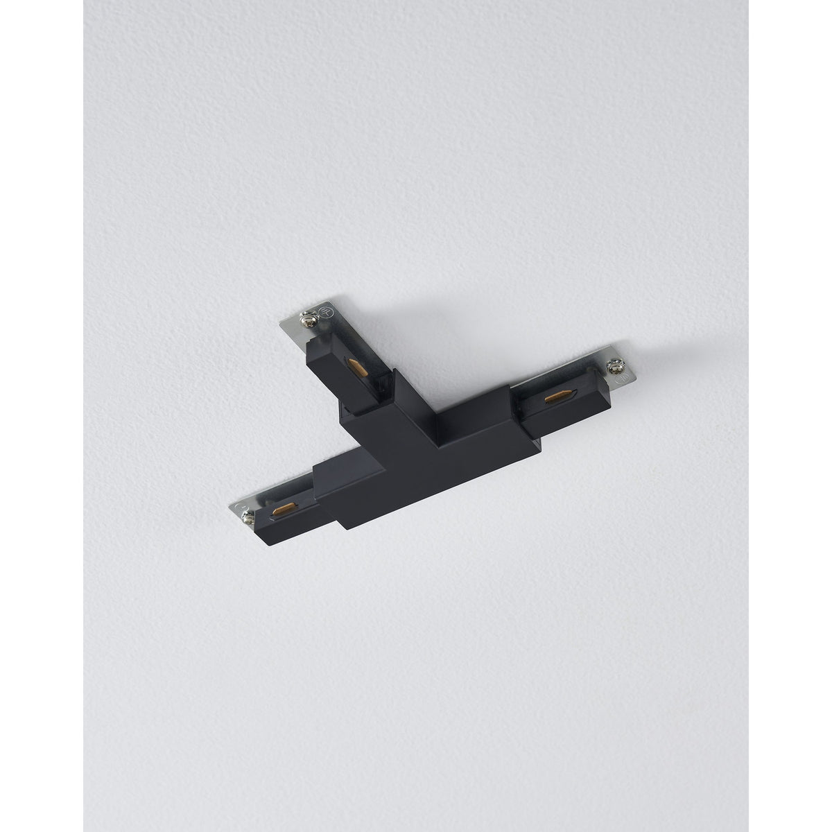 Easyt Track T Connector in black plastic, T-shaped with three silver mounting plates, shown mounted on a white ceiling.