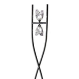 The Eclipse 2 Light Floor Lamp in black chrome features a sleek, crossed base and two clear geometric glass shades placed opposite each other, offering bold contemporary lighting for modern interiors.