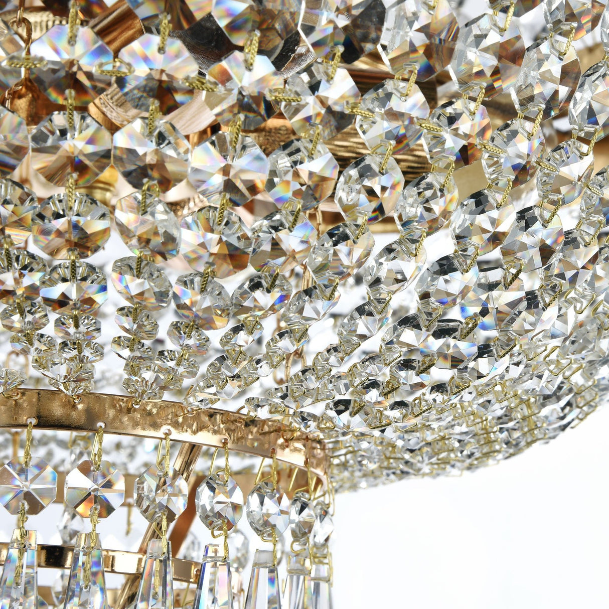 Discover the Palace 6 Light Crystal Chandelier - Gold, featuring intricate crystal pendants and gold accents. This exquisite piece adds vintage elegance to modern interiors, creating a sparkling allure against a light background.