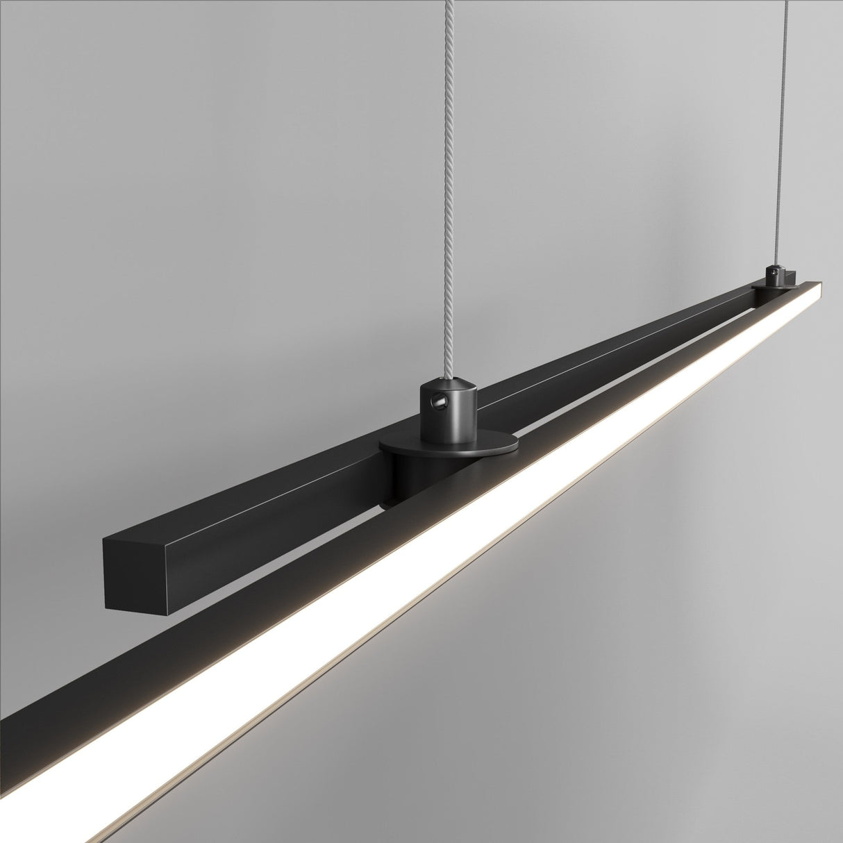 Close-up of Halo LED Extra Long Linear Suspension Light in black, focusing on its smooth, minimalistic finish