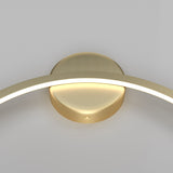 Close-up of the Halo LED Medium Ring Wall Light, 36W 4000K - Brass, a modern circular fixture. The energy-efficient LED curves outward from the base, offering an elegant minimalist design against a neutral backdrop.