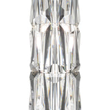 A close-up of the Puntes Table Lamp - Gold With Crystal reveals intricately faceted glass that reflects light, creating a symmetrical, kaleidoscopic effect. This luxurious lamp elegantly complements the vertically aligned crystal accents in the image.
