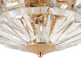 Close-up of the Facet 4 Light Flush - Gold & Crystal. It features a geometric, faceted glass design in a gold-toned frame with a central gold knob. The light reflects through the crystal, creating an elegant, shimmering effect like a luxury chandelier.