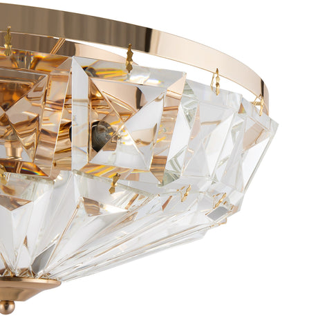 Close-up of the Facet 6 Light Flush, showcasing a luxurious design with a gold frame and clear geometric crystal accents. This elegant and modern chandelier beautifully reflects light, emphasizing its intricate crystal details.