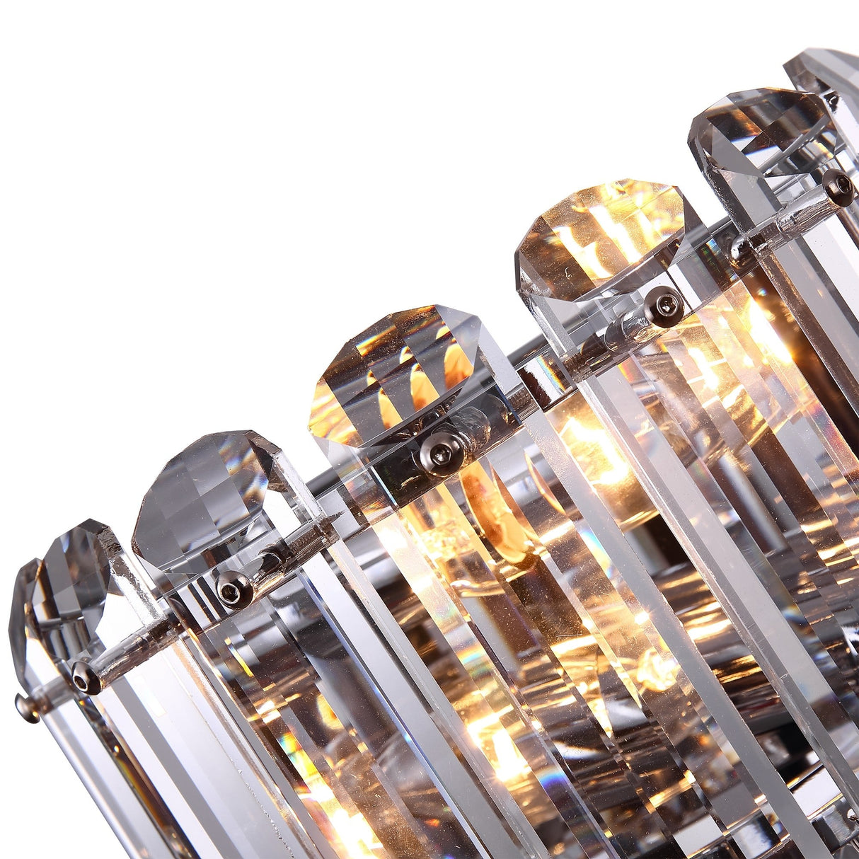 Close-up of the Hail 2 Light Wall Light - Chrome with clear, faceted glass prisms reflecting warm ambient lighting for a sparkling effect. The crystal accents are arranged vertically and secured with metal fixtures.