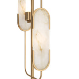 The Marmo 2 Light Floor Lamp in Brass showcases elongated, oval-shaped marble-effect lamps in a sleek gold frame. Its elegant design emphasizes clean lines and luxurious natural stone elements.