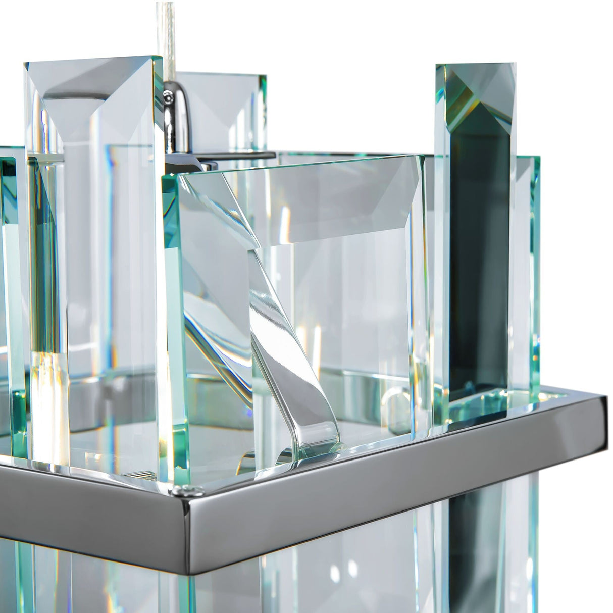 The Cerezo Single Glass Pendant Light - Chrome showcases a modern, abstract glass design with rectangular and angular shapes in clear and blue-tinted glass, enhanced by metallic accents. When lit, dynamic reflections akin to minimalist lighting enhance its allure.