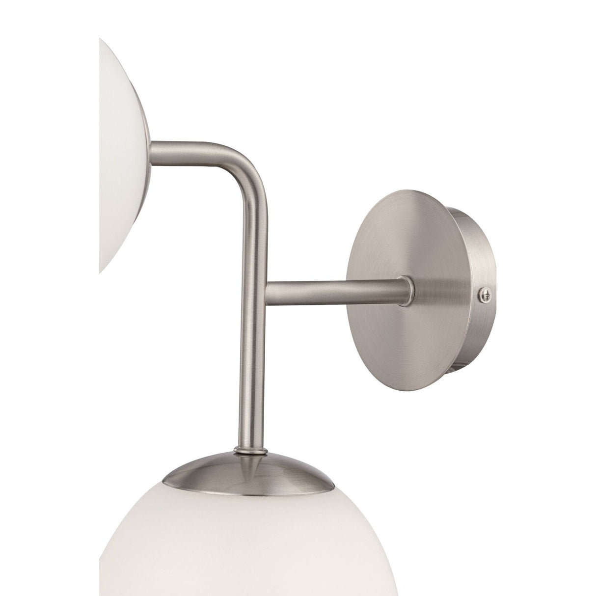 Close-up of the Erich 2 Light Wall Light in Nickel, featuring modern elements with a round base and two white glass globe shades on curved metal arms, embodying a sleek minimalist contemporary style.