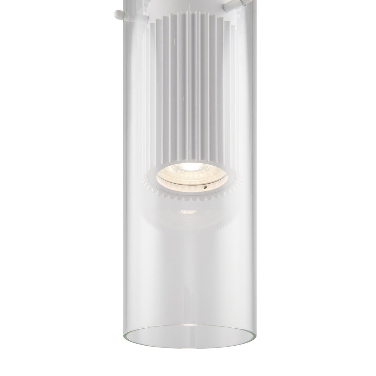 The Dynamics Pendant Light features a modern design with an aluminum frame and clear glass casing. A white ribbed structure around the bulb emits a soft glow, accentuating its sleek lines and minimalist style—ideal for contemporary interiors.
