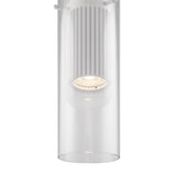 The Dynamics Pendant Light features a modern design with an aluminum frame and clear glass casing. A white ribbed structure around the bulb emits a soft glow, accentuating its sleek lines and minimalist style—ideal for contemporary interiors.