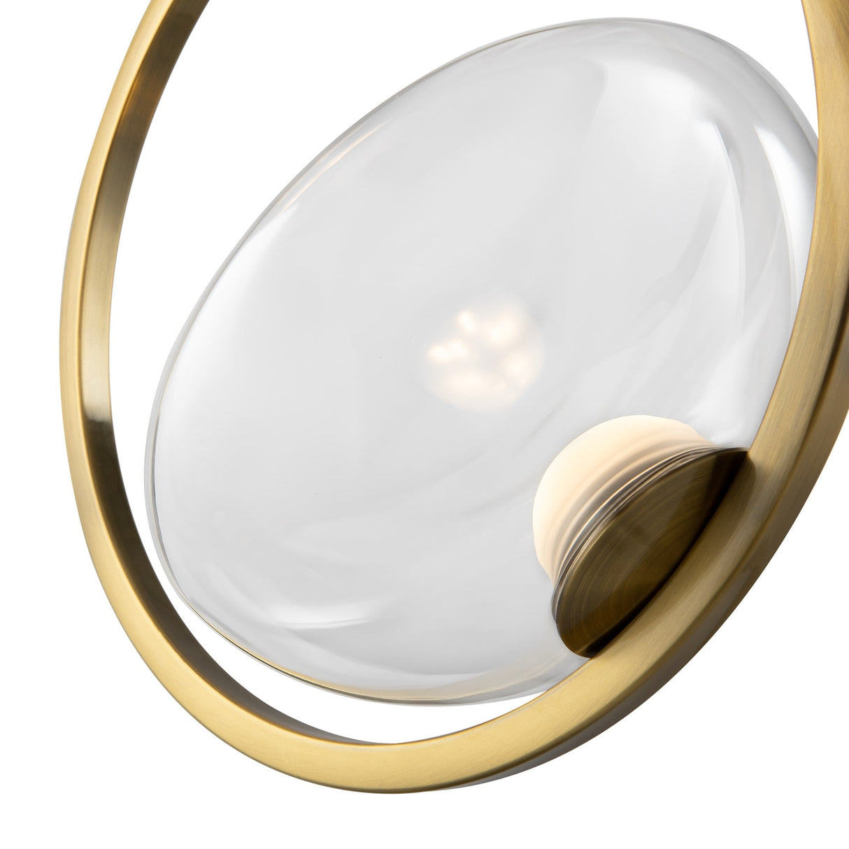 Introducing the Lunare LED Single Ring Pendant Light - Brass With Clear Glass, a modern masterpiece with a minimalist design, featuring a translucent glass orb in a brass frame. Its partially visible light source casts a soft glow that enhances any space.
