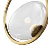 Introducing the Lunare LED Single Ring Pendant Light - Brass With Clear Glass, a modern masterpiece with a minimalist design, featuring a translucent glass orb in a brass frame. Its partially visible light source casts a soft glow that enhances any space.