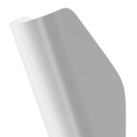 A close-up of the Notta Bidirectional Wall Light - White, displaying its smooth texture and elegant geometric design against a plain white background.