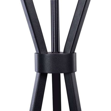 Close-up of the Toronto Customizable Floor Lamp Base - Black, showcasing intersecting legs and a central circular connector. Its sleek, modern design complements the minimalist frame, highlighted by a smooth matte finish.