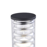 The Bronx Bollard Light 796mm in black combines a sleek cylindrical design with corrosion-resistant aluminum rings inside a transparent casing, finished with a flat cap. This modern outdoor fixture emits a soft glow, ideal for contemporary spaces.