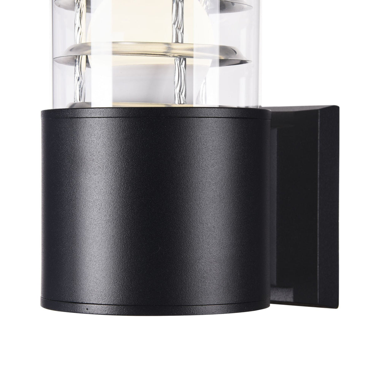 Close-up of the Bronx Outdoor Wall Light - Black: a modern cylindrical outdoor sconce with transparent sections showing interior elements, mounted on a square base. It features a corrosion-resistant black finish and emits a soft glow when lit.