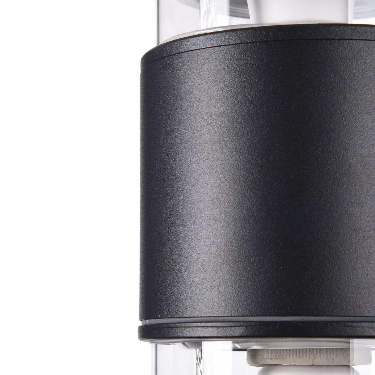 The Bronx Outdoor 2 Light Wall Light in black features a modern, sleek cylindrical design. Its dual-light structure enhances the minimalist allure, contrasting black and transparent elements that reveal metallic components inside.
